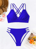 Women's black V-neck halter bikini with removable padded bra and split shorts.