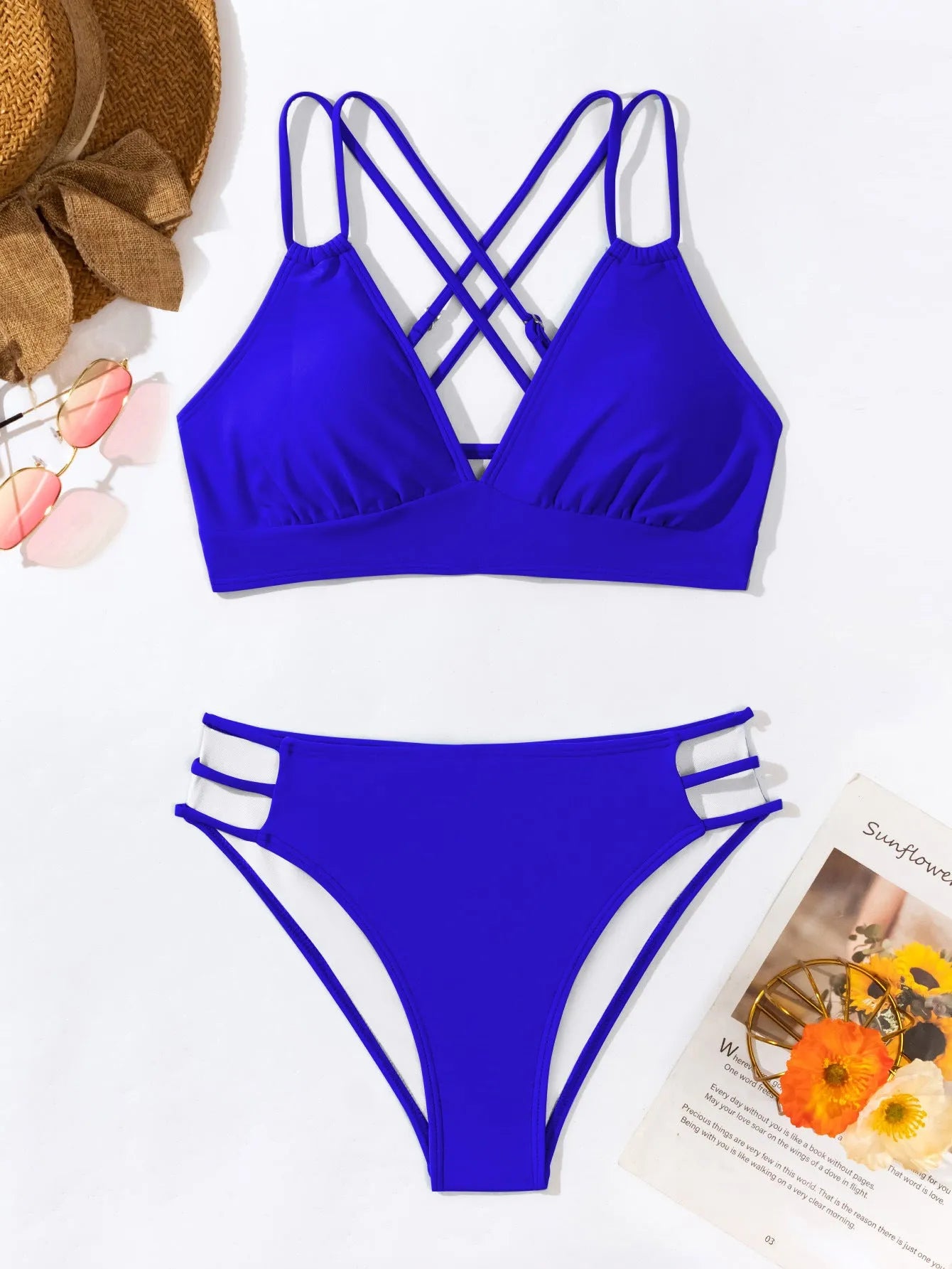 Women's black V-neck halter bikini with removable padded bra and split shorts.