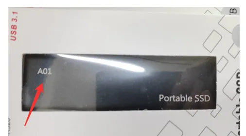 Metal-shell portable solid state drive with ultra-thin design on a desk.
