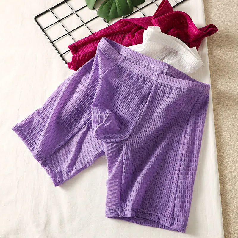 Men's solid colour lace boxer briefs for hip lifting and shaping, shown in light purple.
