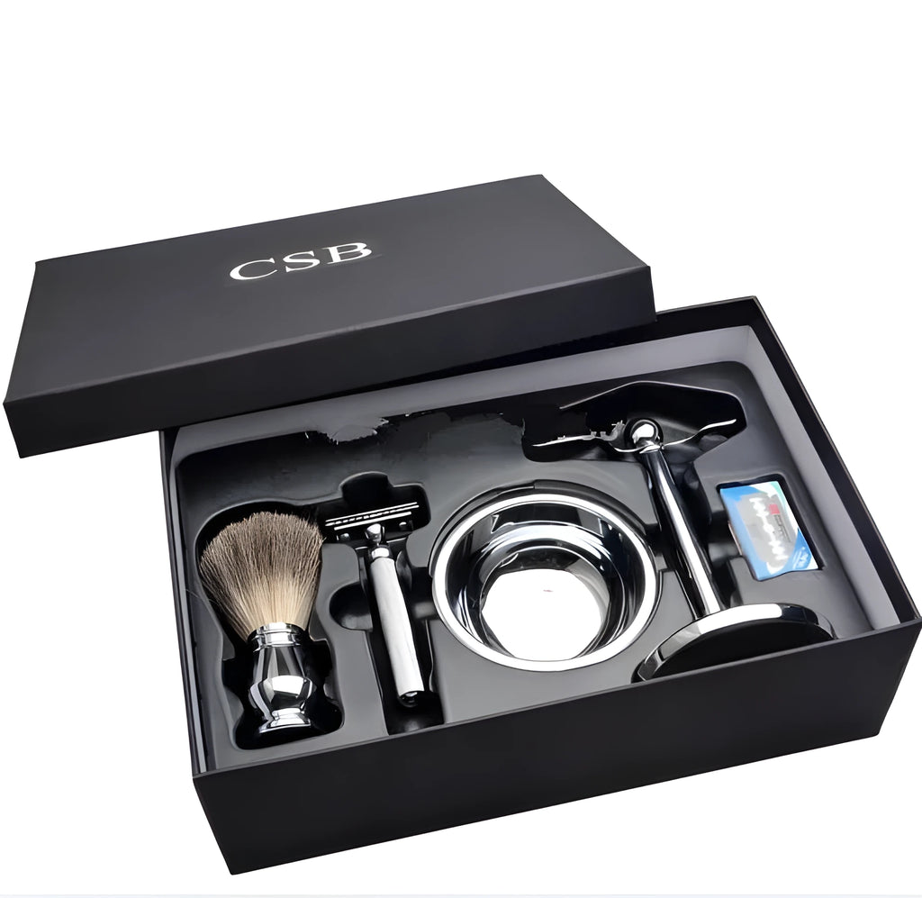 CSB men's shaving kit with chrome stand holding a double edge razor and badger hair brush, plus soap bowl and blades.