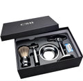 CSB men's shaving kit with chrome stand holding a double edge razor and badger hair brush, plus soap bowl and blades.