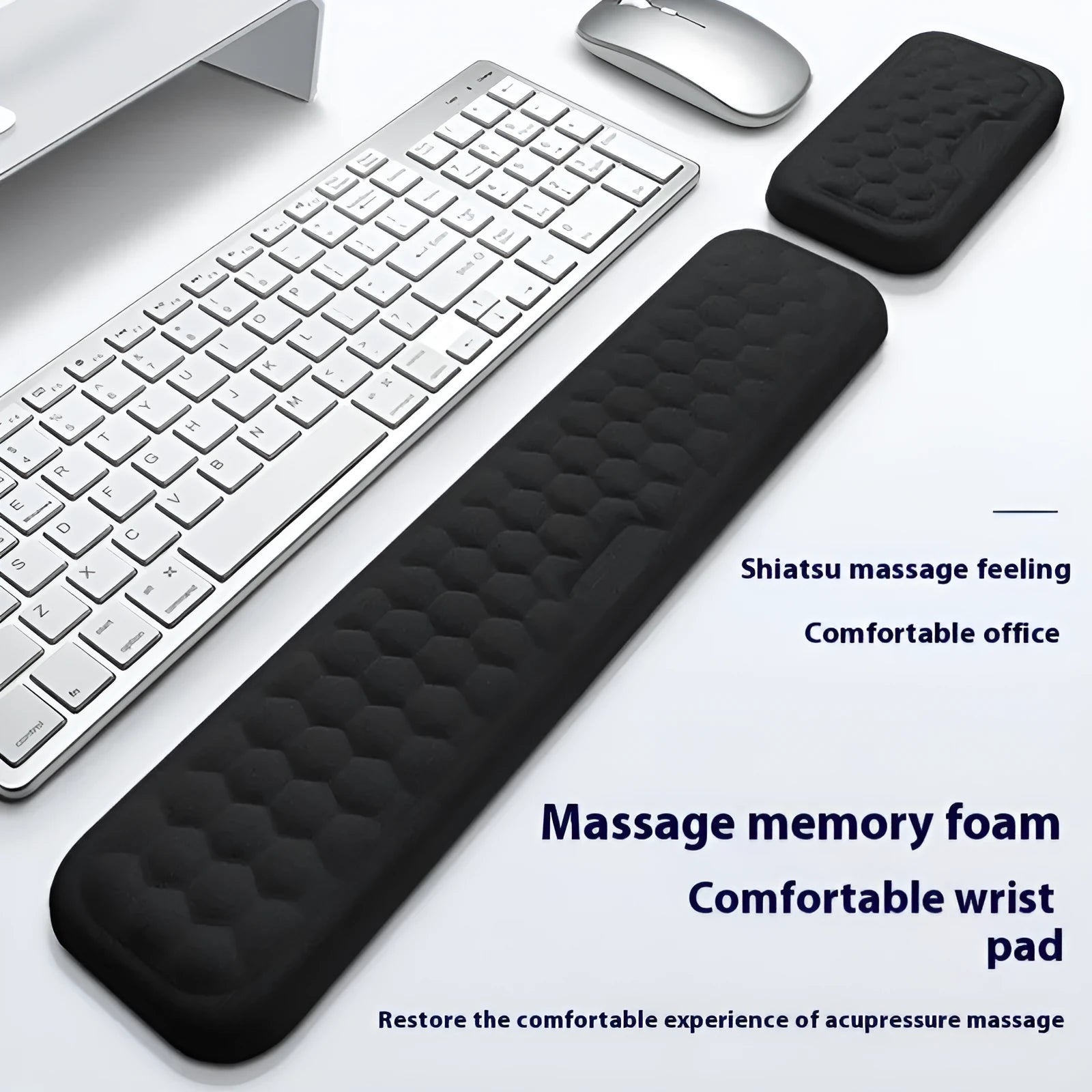 Customisable memory foam mouse wrist pad with black cloth cover on a desk.