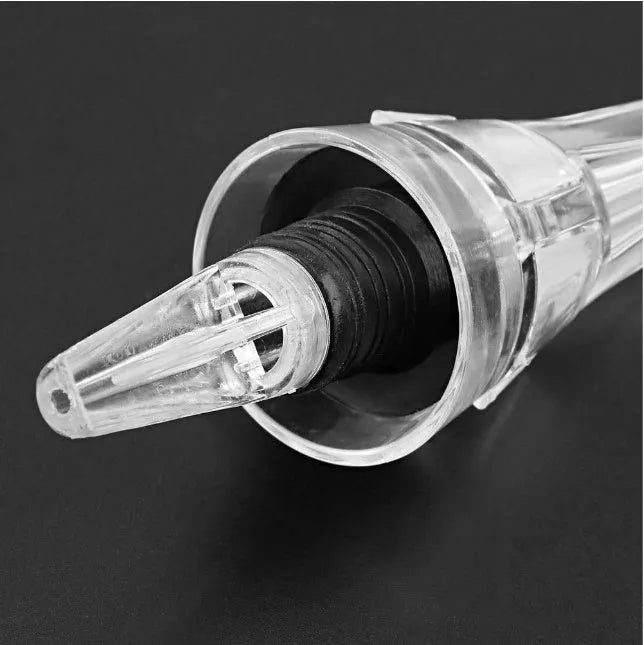 Compact transparent wine aerator with stainless steel filter measuring 16 by 4.2 centimetres