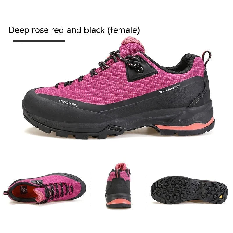 Men's low-top hiking boot in black with front lace-up, rubber outsole, and leather mesh upper.
