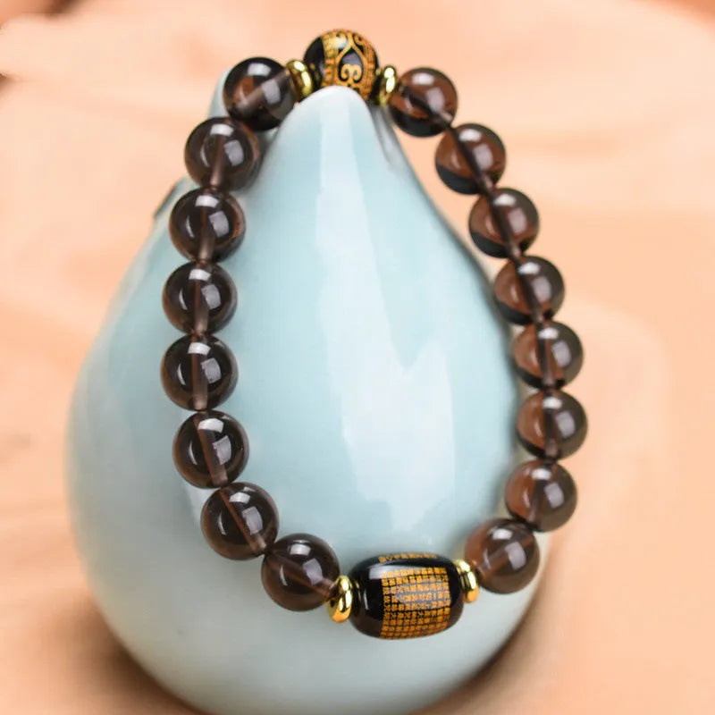 Natural obsidian Heart Sutra bracelet on display with 10mm and 14mm bead options