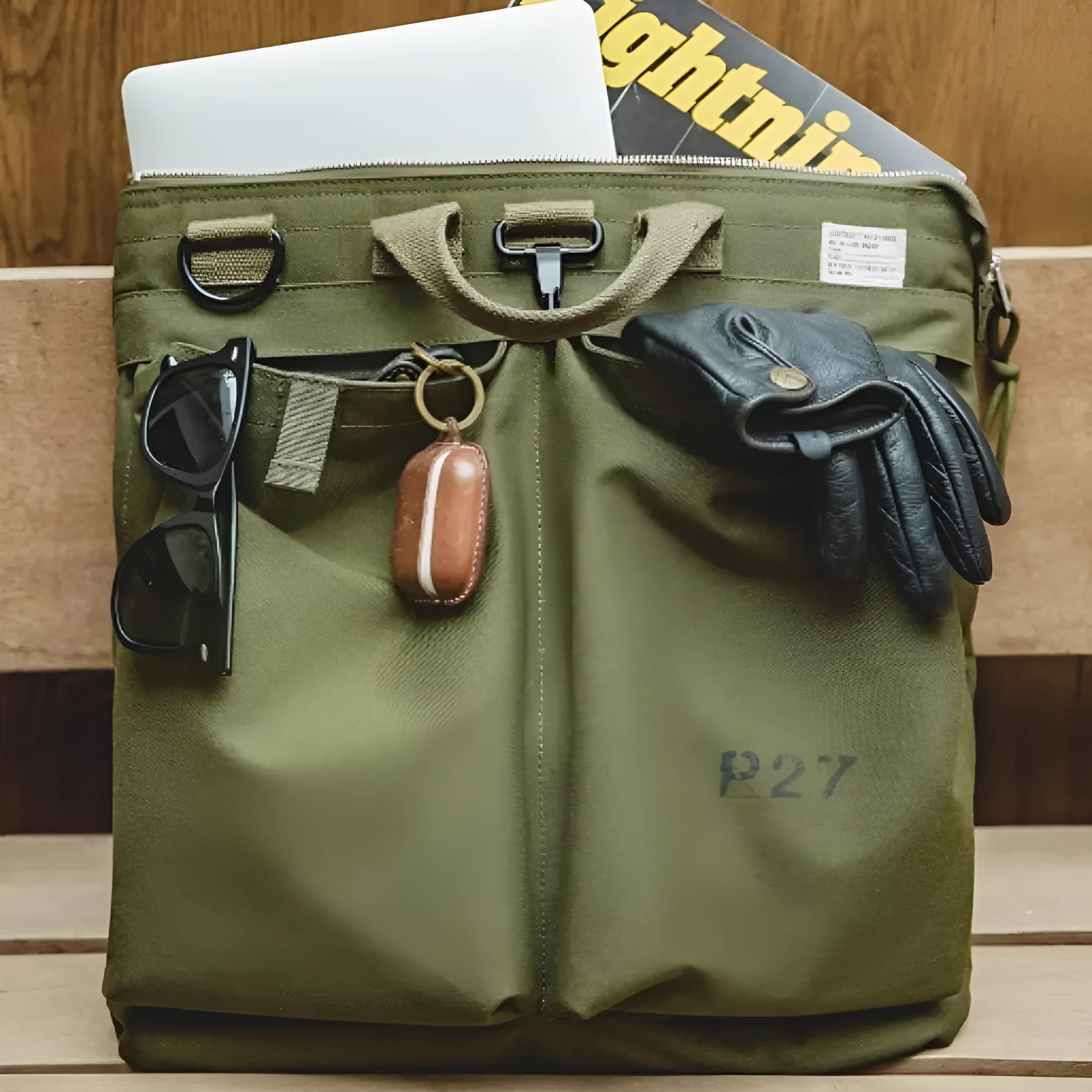 Medium vertical square canvas crossbody messenger bag in military green with shoulder strap