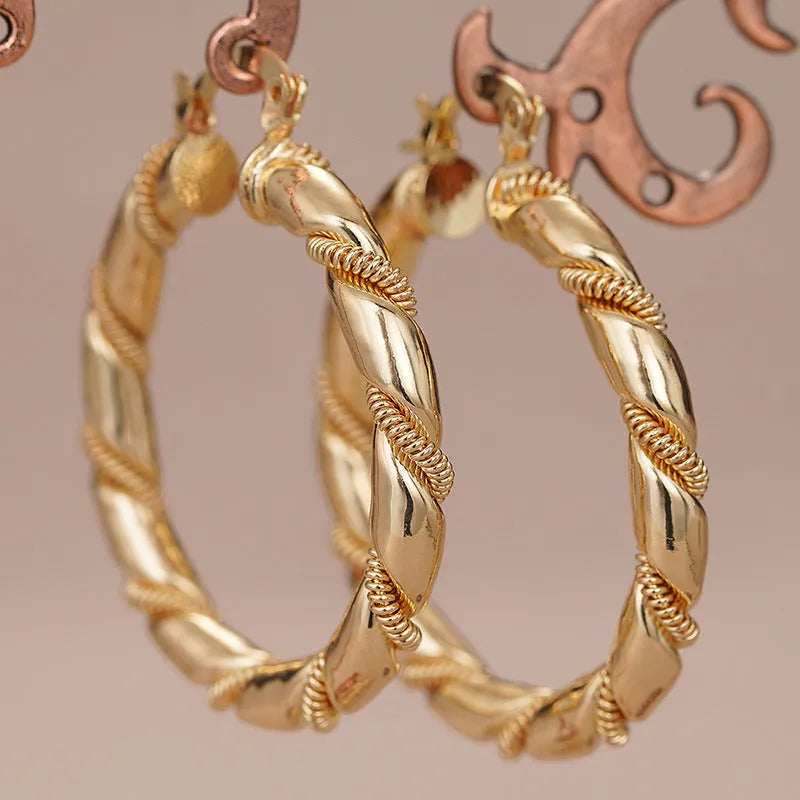 Copper geometric earrings for women in three golden colours with ring and line design elements