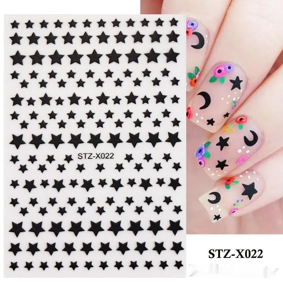 Plastic sheet of black, silver, and cartoon design nail art stickers for DIY manicures.