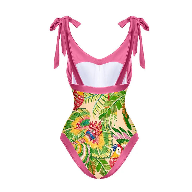 Pink floral print one-piece swimsuit with V-neck, covered belly, and an attached skirt.