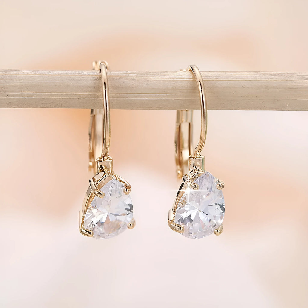Drop-shaped women's metal earrings with gem inlay in gold or platinum colour