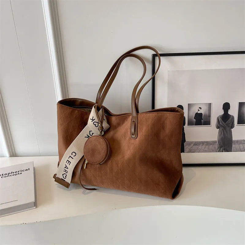 Large polyester shoulder tote bag in horizontal square shape with zipped compartment and sandwich pocket