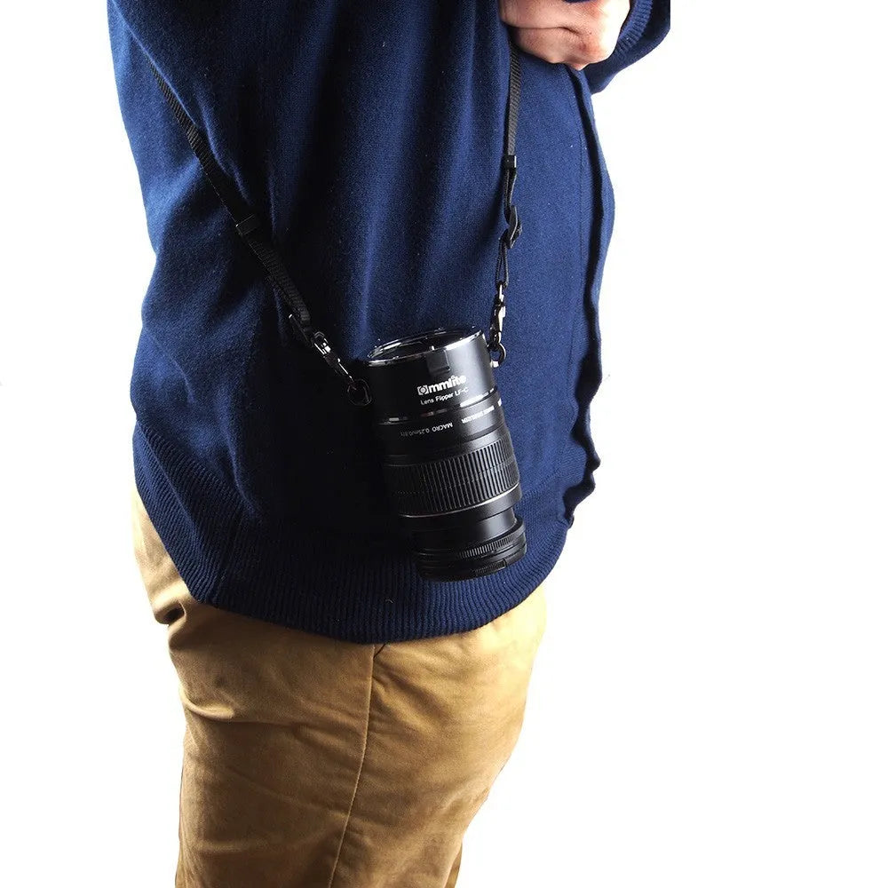 Aluminium lens flipper for Nikon E-Mount cameras with cotton shoulder strap showing double lens holder design
