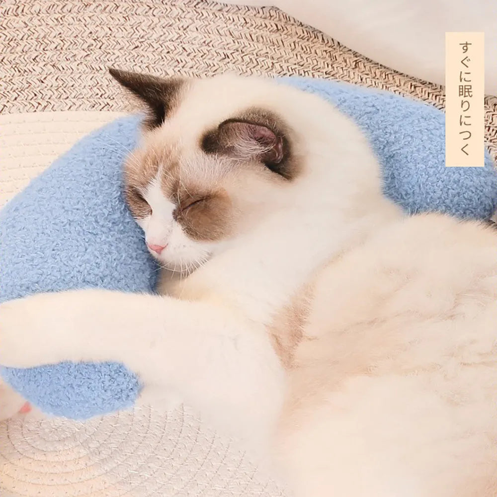 U-shaped blue cat pillow with adjustable collar for cervical support on a sofa