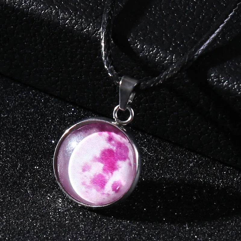 Luminous moon and constellation design pendant on an alloy necklace chain with extension.