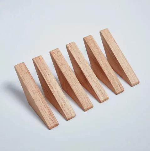 Triangle rubber wood wall hook with modern minimalist design for hanging coats and bags