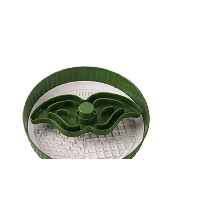 Grey rotating pet slow feeder bowl with a blue silicone windmill-pattern licking mat attached.