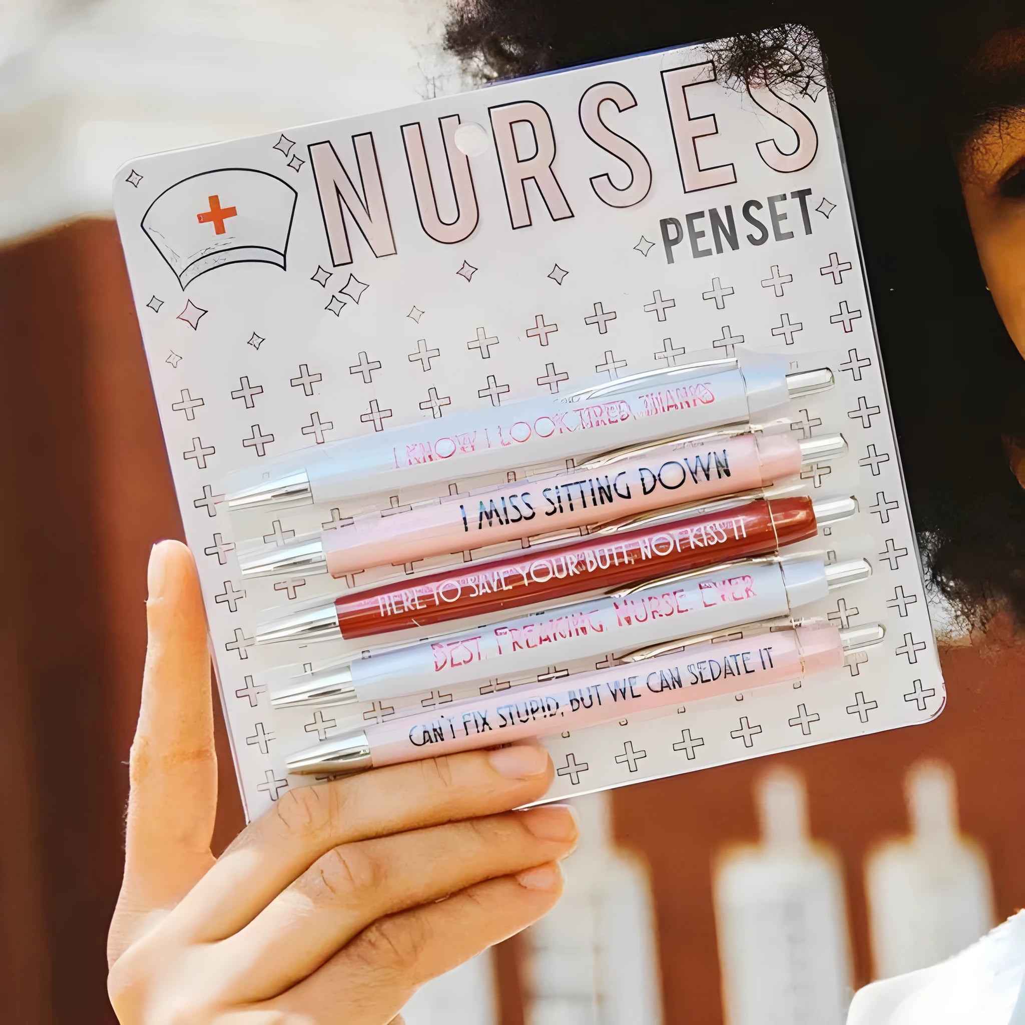 Set of five blue nurse-themed retractable ballpoint pens with plastic casing.