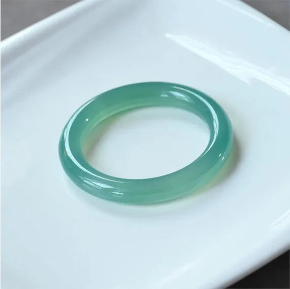 Natural agate wide tire bracelet showing polished stone band in multiple colour options