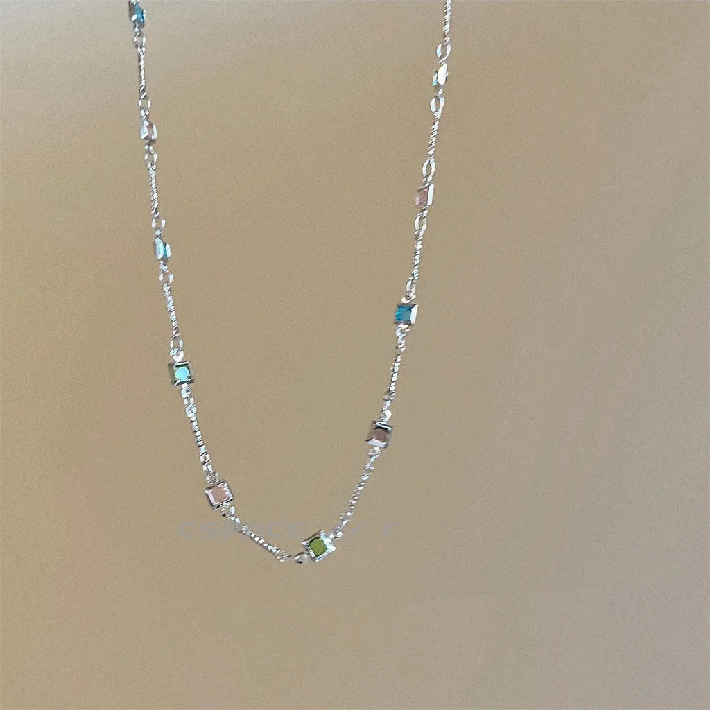 Square colour clavicle chain necklace with geometric quadrilateral crystal elements in gold and white K finishes