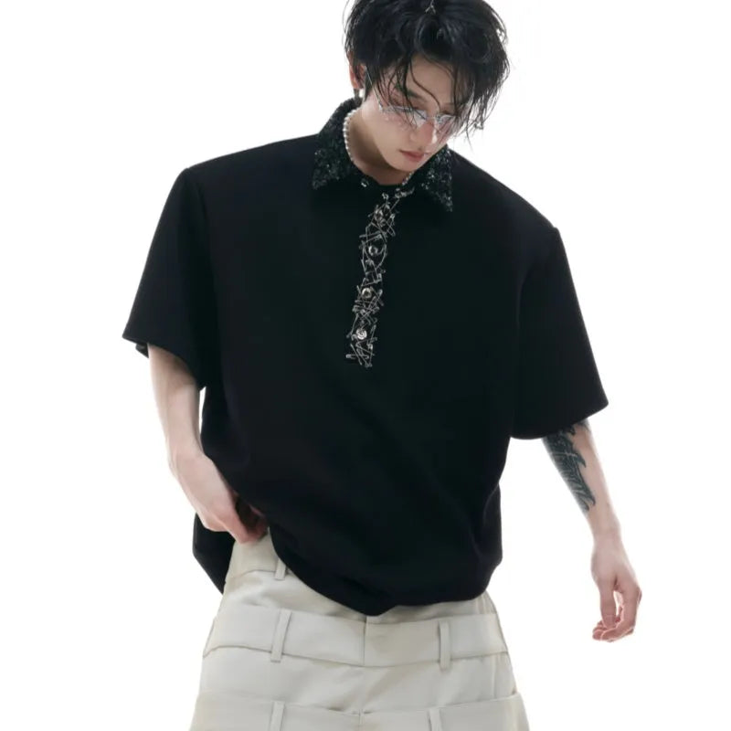 Men's black loose fit polo shirt with square collar and short sleeves decorated with embroidery sequins.