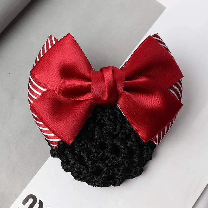 Professional hair clip with a black net pocket and a red flower bow ornament on a white background.
