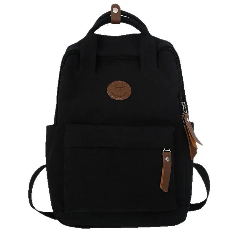 Black Oxford cloth backpack with curved shoulder straps and retro sewing thread accents
