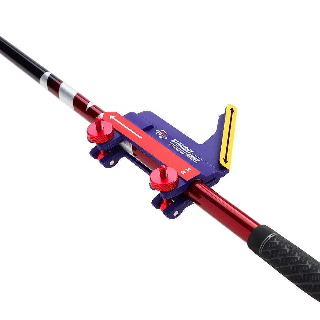 Plastic golf swing plane simulator training aid on practice surface