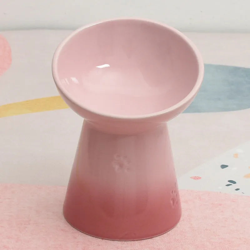 A white ceramic pet bowl with a high foot and raised neck protector to prevent tipping.