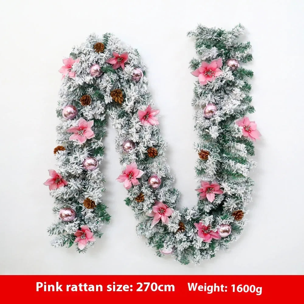 Christmas rattan garland decoration with flocked texture in five colour options displayed draped