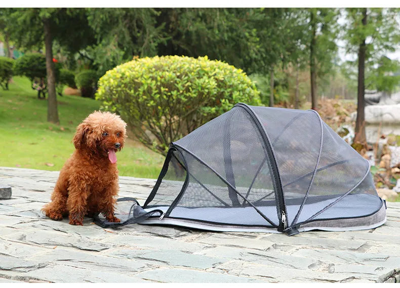 Portable folding cloth tent for cats in blue half mesh variant, set up as a travel bed.