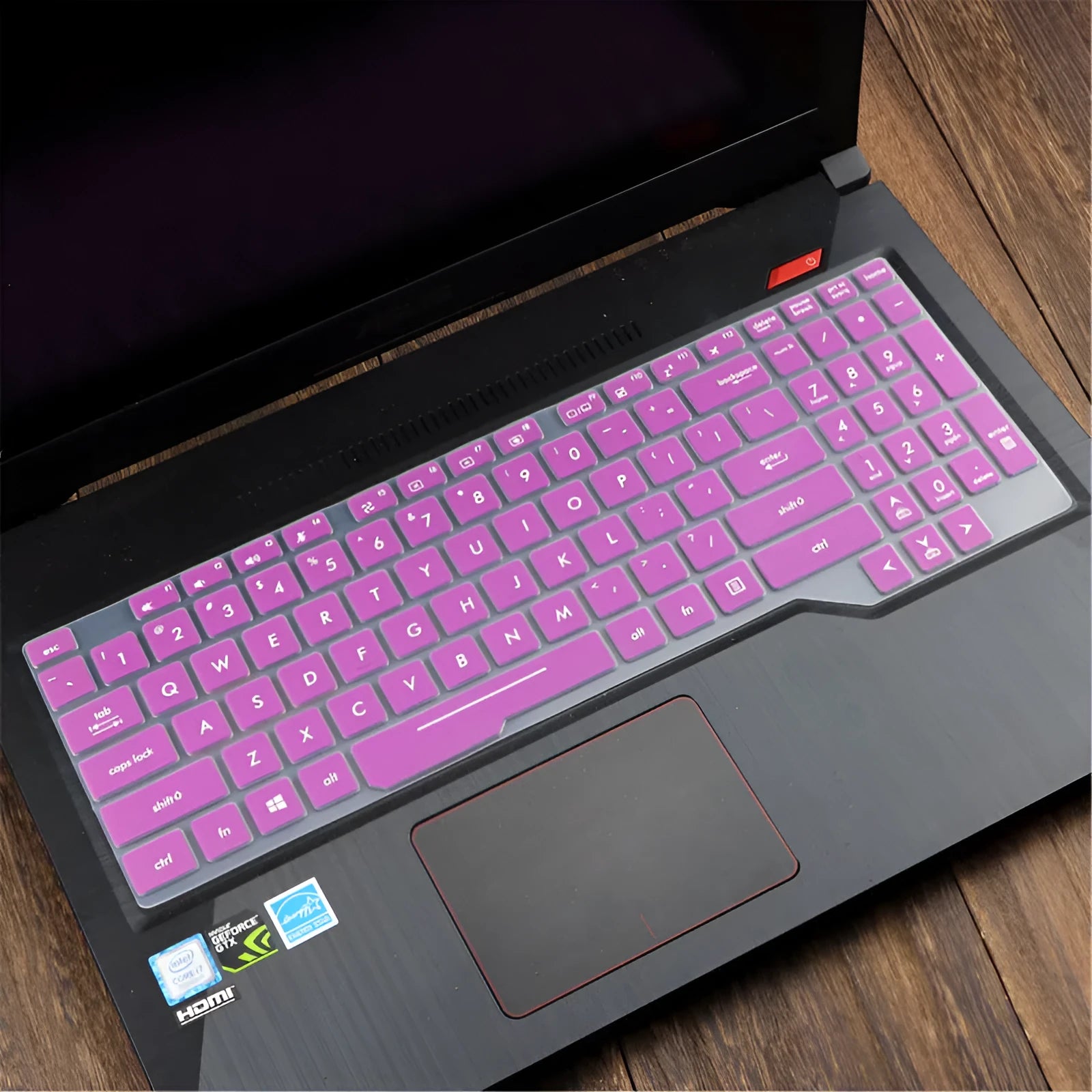 Transparent silicone keyboard protective film for ASUS Flight laptop on a keyboard.