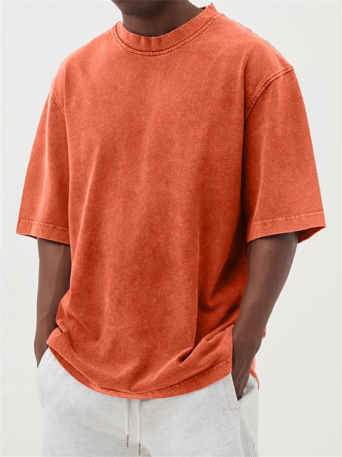 Men's loose fit distressed stone wash pullover t-shirt in solid colours like army green and blue.