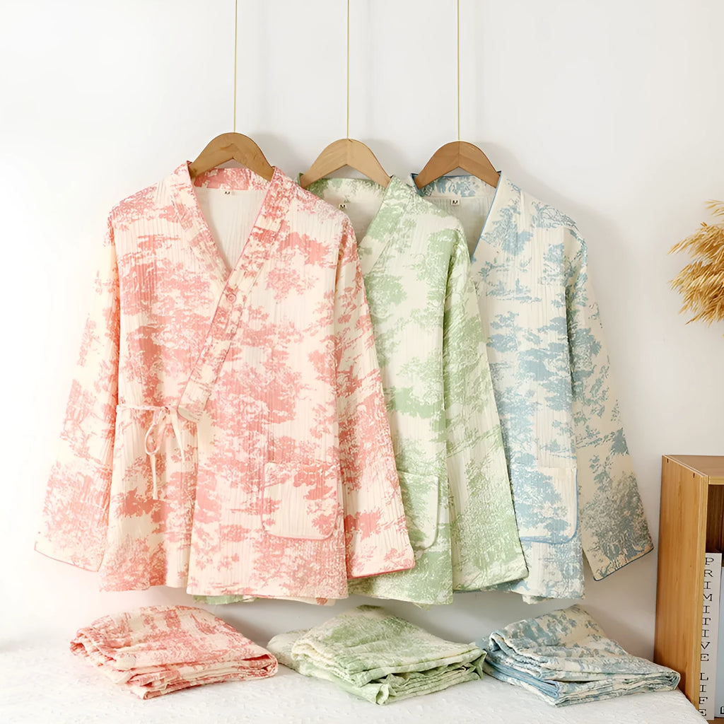 Women's pink pure cotton gauze long sleeve lounge suit top and trousers on a hanger.