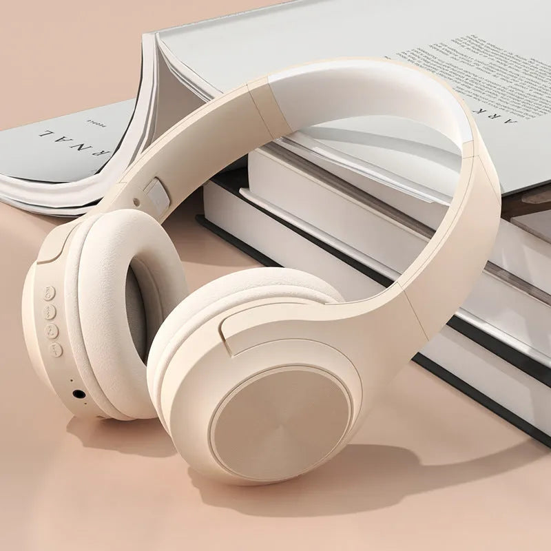 Creative wireless Bluetooth headset in chalk black, ivory white, or youth green colour on a charging stand
