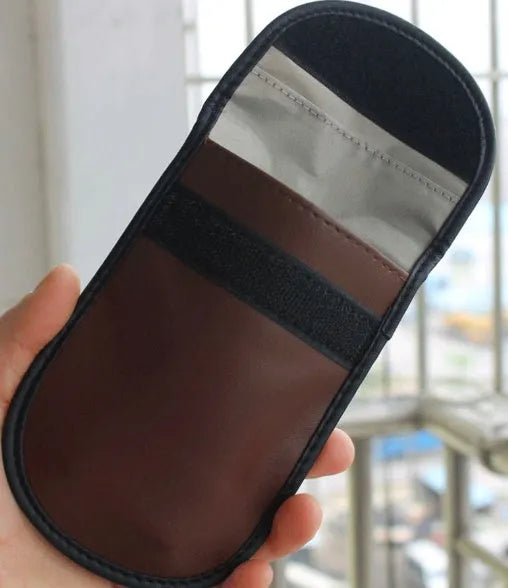 Black microfiber Faraday cage bag for blocking car key fob and mobile phone signals.