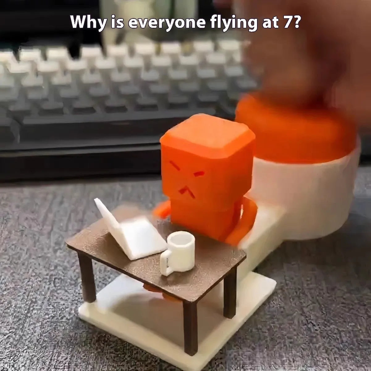 Orange plastic vent decompression fidget toy on a table, showing its 16cm length and turning mechanism.
