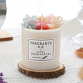 Scented aromatherapy candle with dried flower decoration and natural wood chip base