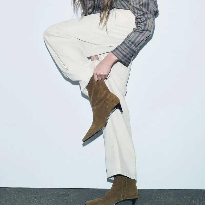 Brown square toe ankle boot with side zip and a mid-height stiletto heel on a waterproof platform sole.