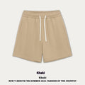 Casual cotton denim shorts for a baby boy or girl in a loose fit, shown in khaki colour.