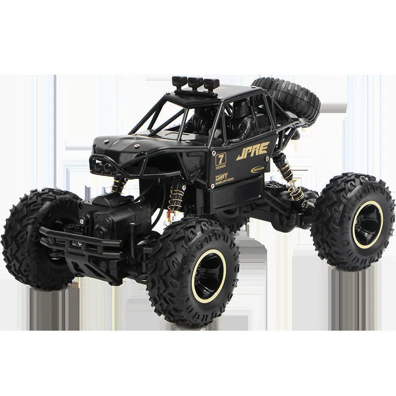 Large black or silver 4WD remote control climbing car on off-road terrain with wireless remote.