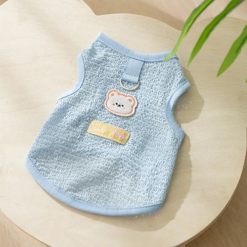 Green knitted cat clothing with a hollowed-out cartoon bear patch on the back.