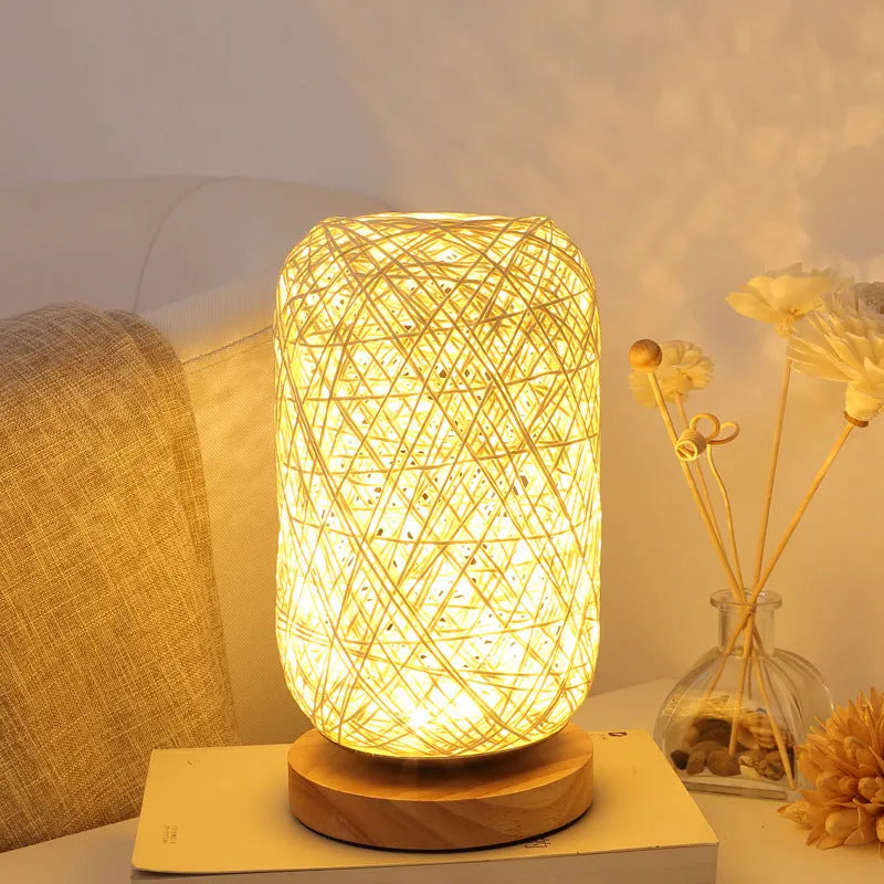 Brown hemp rope Sepak Takraw ball desk lamp on a wooden base with USB cable.