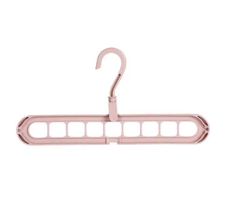 Plastic clothes hanger with rotating hook in assorted colours on white background