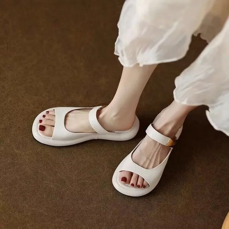 Women's apricot peep toe platform sandals with a soft leather upper and rubber sole.