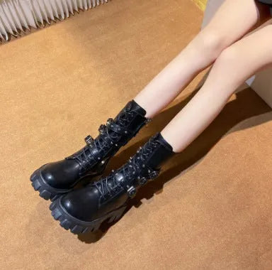 Women's black mid-calf knight boots with a side zip and metal buckle detail on the shaft.