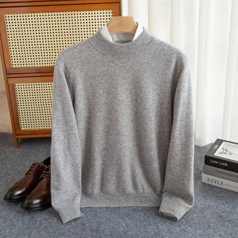 Man wearing a loose-fit half-collar wool sweater in a textured knit, shown in one of the available colours like camel or dark grey.