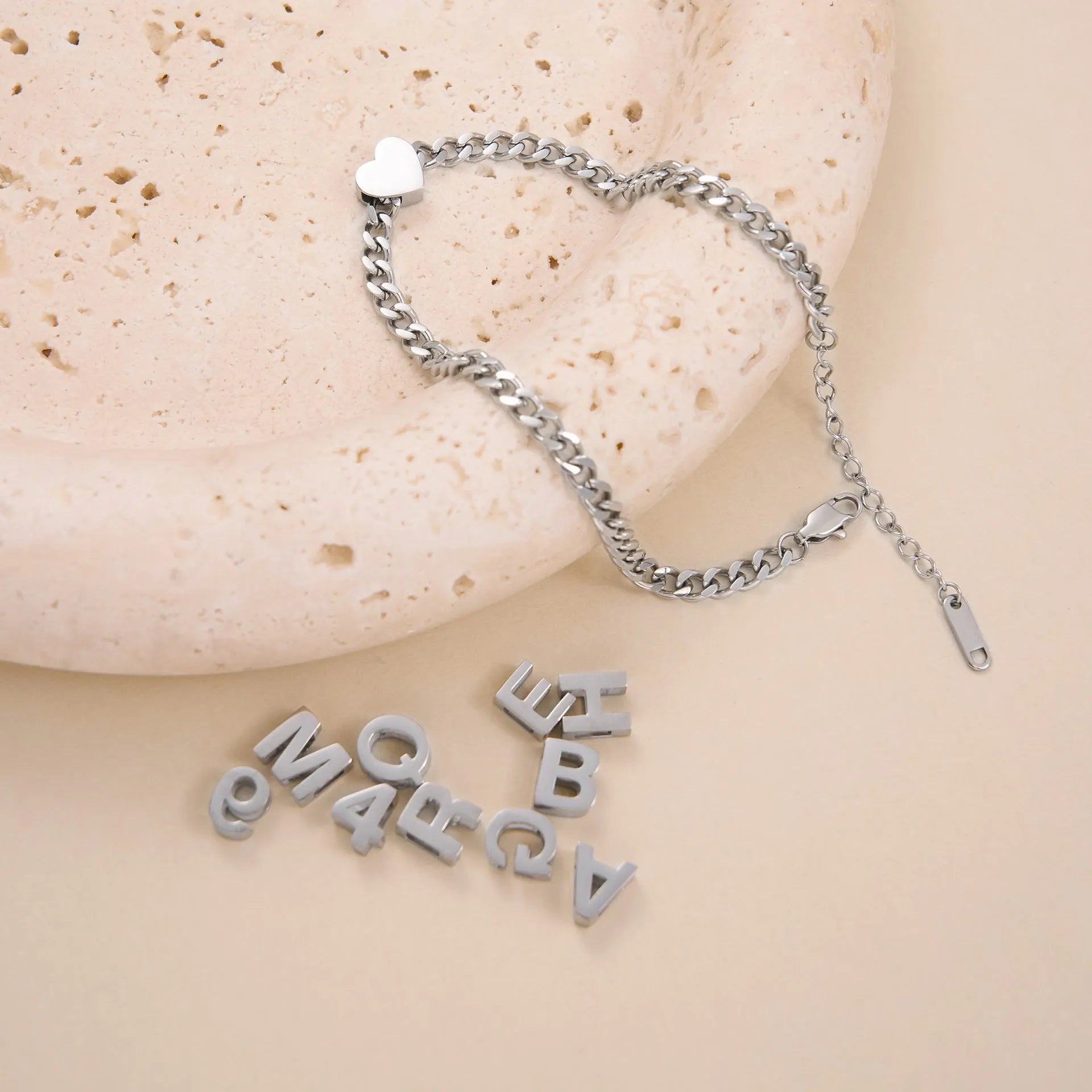 Titanium steel necklace with a single charm showing a number or letter on a 40.5cm gold or silver chain.