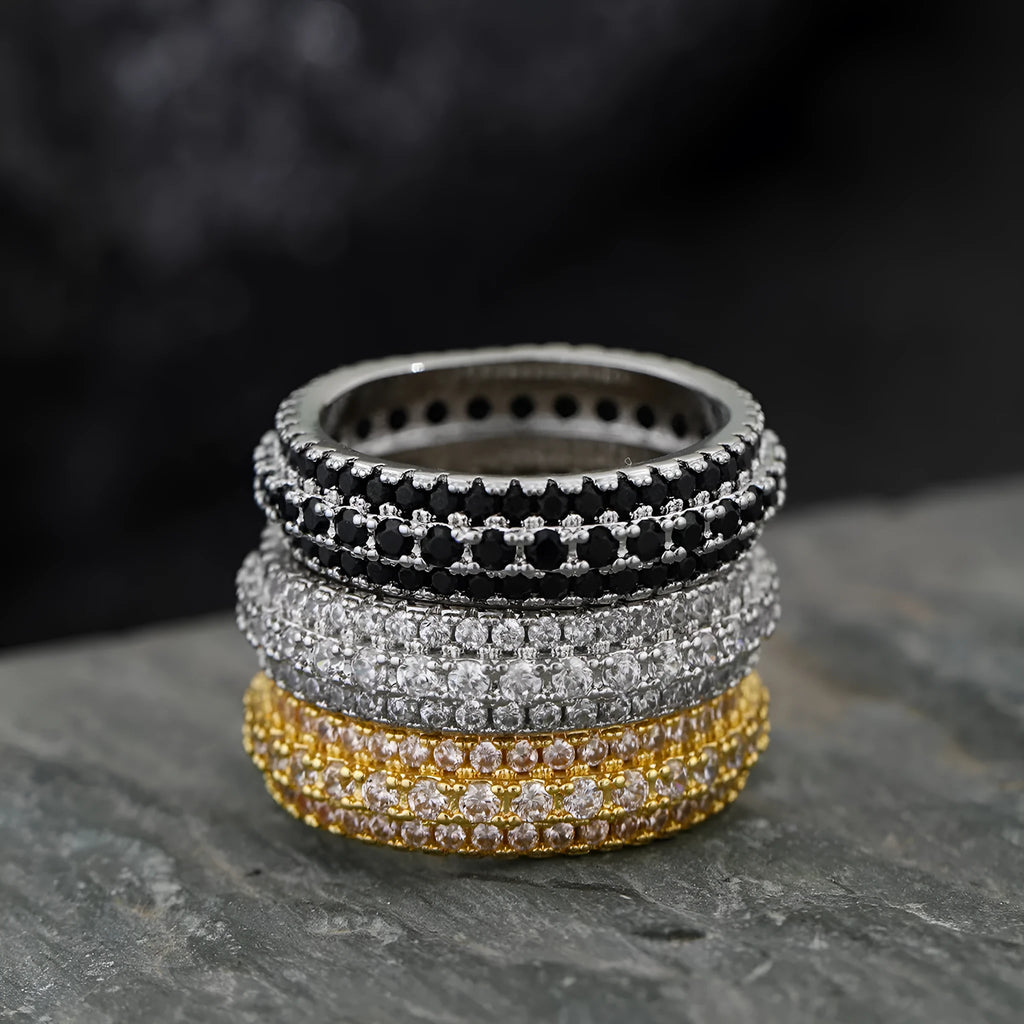 Geometric gang drill style engagement ring with a triangular zircon stone inlay on a metal band.