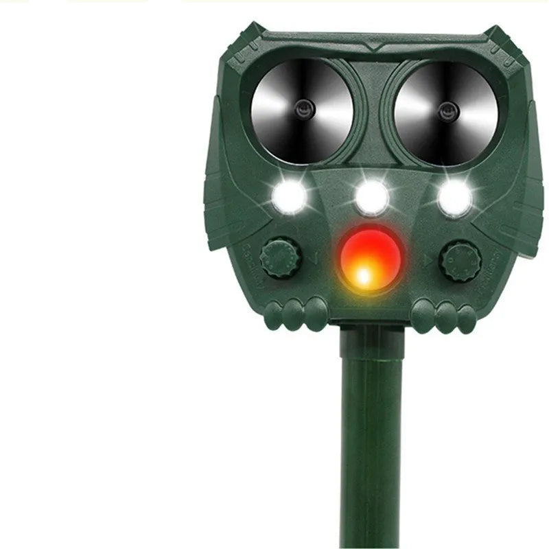 Green solar ultrasonic animal repeller unit with solar panel on top.